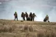 Members of Infantry Battle School evacuate a casualty during
