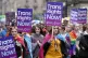 People carrying Trans rights banners take part in the Pride 
