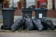 Rubbish bags piled up in front of bins in Moseley Road, Birm