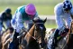 Breath Caught ridden by Ryan Moore (left) goes on to win The