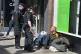 Police officers talk to a homeless man in Windsor, Berkshire