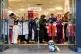 A dog waits outside as people cram into a shop in Edinburgh 