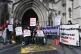 Campaigners outside the Royal Courts of Justice in London su