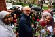 Labour Party leader Jeremy Corbyn is presented with some flo