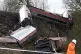 TRAGEDY: Rail workers attend the scene of the rain crash at 