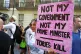 A woman protests against Boris Johnson in Russell Square thi