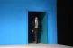 Sajid Javid emerges from behind a blue door at the Tory Part