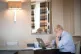 Unelected Prime Minister Boris Johnson sits by a computer in
