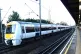 A c2c train passing a station in London