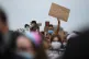 A woman holds up a sign during a Black Lives Matter protest 