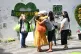 People at the Grenfell Memorial Community Mosaic at the base