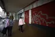 Shoppers walk past boarded up shops in Sheffield