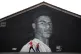 Jacob (left) and Joshua Hallighan in-front of a mural of Man
