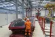 Workers prepare the moulds for the concrete tunnel headwall 