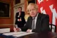 Brexit Minister David Frost looks on as Prime Minister Boris