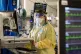 A nurse works on a computer in the ICU (Intensive Care Unit)