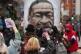 Black Lives Matter demonstrators take a knee during a 'Kill 
