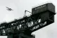 A seaplane flys over the Clydeport crane in Glasgow
