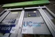 A Universal Credit sign on a door of a job centre plus in ea