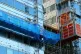 Workers remove cladding from a building in Paddington, Londo