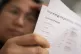A person holding an energy bill
