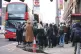 People attempt to board a bus at Waterloo station in London