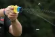 A police officer demonstrating the use of a Taser