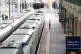 A member of staff signals to a train at King's Cross railway