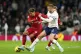 Liverpool's Roberto Firmino (left) and Tottenham Hotspur's E