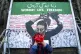 An Iranian artist helps to create the Women Life Freedom mur