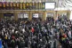 Passengers wait at the barriers at King's Cross station in L