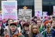 People take part in a demonstration for trans rights outside