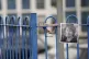 A photograph of Ruth Perry attached to the fence outside Joh