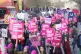 Protesters marching during a rally as members of the Univers