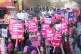 Protesters marching during a rally as members of the Univers