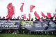 Steelworkers and union officials take part in a protest outs