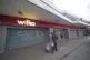 People walk past the closed Wilko store in Barking, east Lon