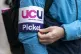 Lecturers and other university staff take part in a rally on