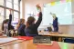 Students and a teacher in a classroom 
