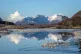 The snow-covered peak of Beinn Eighe and the mountains of To