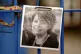 A photograph of Ruth Perry attached to the fence outside Joh