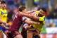 Warrington Wolves' Zane Musgrove (right) tackled by Huddersf