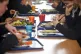 Students eating their school dinner from trays and plates du