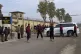 Security guards watch a vehicle carrying Bushra Bibi, wife o
