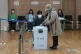 A woman casts her vote for the parliamentary election at a p