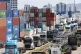 Trucks are parked next to containers at the Inland Container
