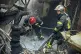 Emergency workers extinguish a fire after a Russian attack o