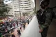 Soldiers stand guard as protesters march in an anti-governme