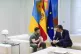 Ukrainian President Volodymyr Zelenskyy (left) talks with Sp