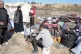 LIVES REDUCED TO TATTERS: Displaced Palestinians arrive in c